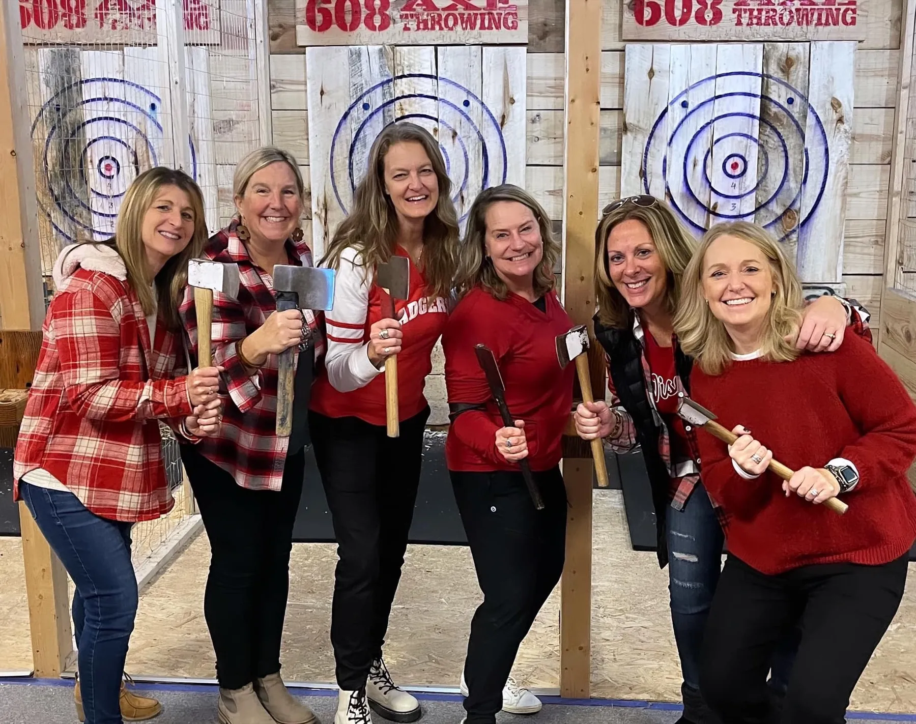 Friends celebrating together after axe throwing